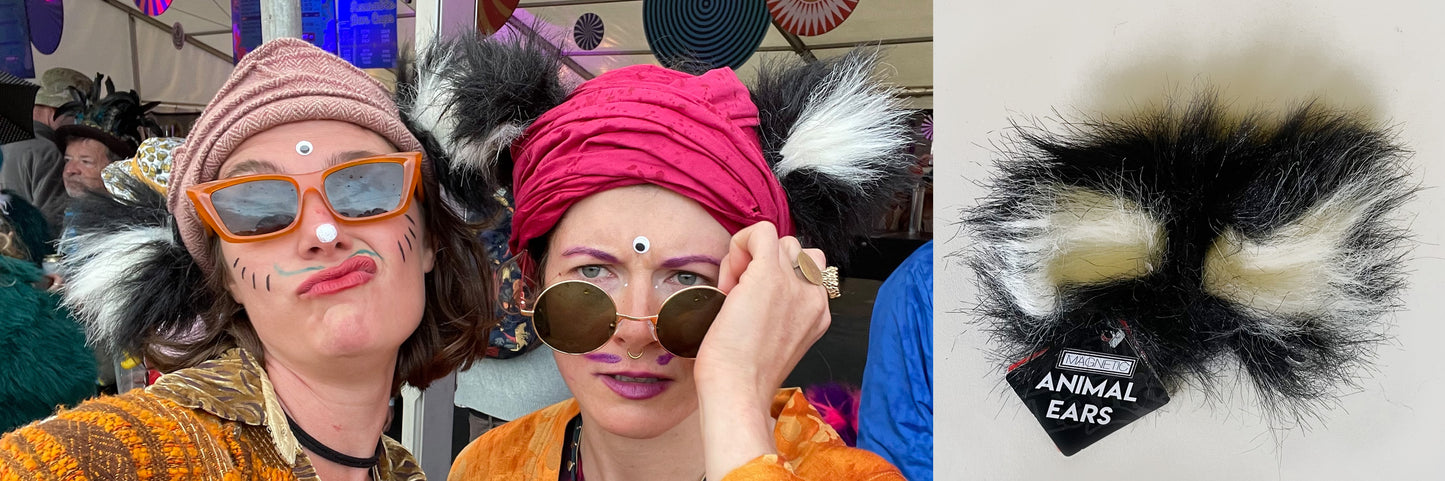 Two humans wearing fluffy animal ears, they look mischievous and are at Shambala festival, they have drawn whiskers on their face and stuck a third eye to their pineal gland. Ears are similar to King Julian from Disney's Madagascar, cat ears, racoon or bear. As seen on Dragons Den. TellTails are perfect stocking fillers, Christmas presents. Novelty fancy dress accessories for hen and stag parties. Brings out the wild side and helps you get in touch with your inner creature.