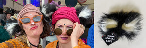 Two humans wearing fluffy animal ears, they look mischievous and are at Shambala festival, they have drawn whiskers on their face and stuck a third eye to their pineal gland. Ears are similar to King Julian from Disney's Madagascar, cat ears, racoon or bear. As seen on Dragons Den. TellTails are perfect stocking fillers, Christmas presents. Novelty fancy dress accessories for hen and stag parties. Brings out the wild side and helps you get in touch with your inner creature.