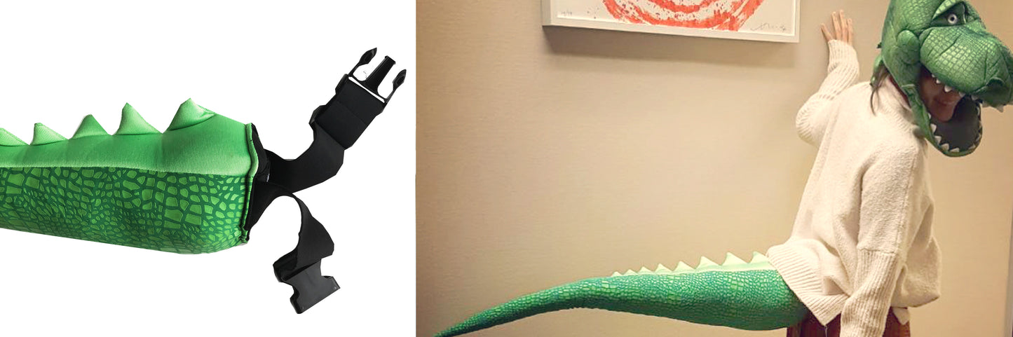 A person in a TellTails Crocodile costume, featuring a scaly tail and toothy headpiece with eyes, playfully poses indoors. Ideal for cosplay or festive events, this outfit is comfortably secured with straps.
