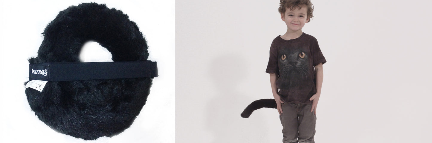 On the left sits The Black Cat, a fluffy black tail by TellTails, while on the right, a child smiles in a cute cat-face shirt with an attached tail, ready for a fancy dress festival against a plain white background.