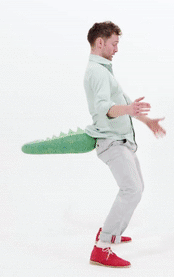 An adult or ‘big kid’ wearing a green crocodile tail with a realistic scale pattern. It buckles on with a waistband. Perfect accessory for dino themed parties, jurassic world fans, a day out with prehistoric friends at the NHM and any crocodile or chameleon characters for World Book Week or cosplay like Gecko from PJ masks or how to train your dragon. Fancy dress accessory for skiing and snowboarding on the slopes. Hen and stag party novelty accessories, twerk, Glastonbury, jungle at boomtown