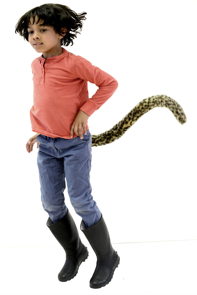 A child aged 8 leoping wearing a costume leopard tail and wellies. Fresh out of a music festival, Glastonbury, Camp Bestival. Perfect for cosplay character or world book day, Madagascar. Perfect for woodland or animal themed parties. Fancy dress novelty accessory for skiing and snowboarding. As seen on dragons den by Deborah Meaden. 